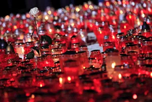 White roses are seen near candles during All Saints Day at Mirogoj cemetery in Zagreb White roses are seen near candles during All Saints Day at Mirogoj cemetery in Zagreb