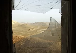 Images Dated 3rd December 2014: A window with broken glass overlooks the Lebanese-Syrian border as seen from a Lebanese