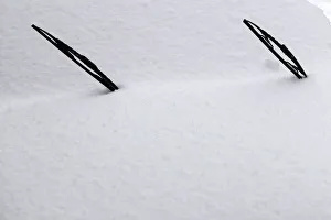 Windscreen wipers of a snow-covered car are seen in Bucharest Windscreen wipers of a snow-covered car are seen in Bucharest