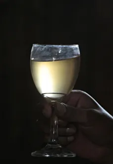 A wineglass of Patero wine produced by La Casa Vieja (Old House) wine cellar in Concepcion A wineglass of Patero wine produced by La Casa Vieja (Old House) wine cellar in Concepcion