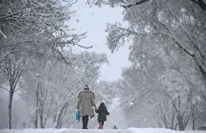 A woman and child walk along the side of the National Mall in Washington A woman and child walk along the side of the National Mall in Washington