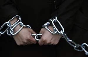 Woman with her hands chained demonstrates during a rally against austerity measures in Woman with her hands chained demonstrates during a rally against austerity measures in