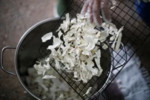 New Gallery: A woman manipulates dehydrated yucca at the Quinta Carmelita store