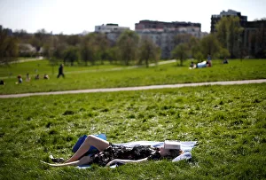 A woman relaxes in the sunshine on Primrose Hill in north London A woman relaxes in the sunshine on Primrose Hill in north London