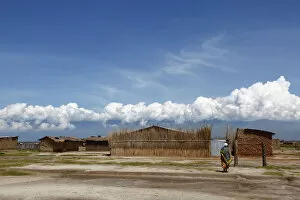 Images Dated 20th April 2013: A woman walks among houses in Gatumba, outside Bujumbura