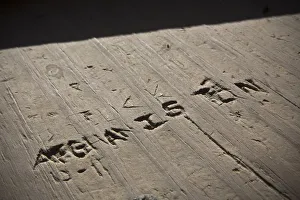 The word Afghanistan is carved into wood in a guard tower at Command Outpost AJK The word Afghanistan is carved into wood in a guard tower at Command Outpost AJK