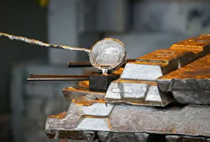 A worker takes a sample of molten alumnium in a shop of Kazakh mining company Eurasian A worker takes a sample of molten alumnium in a shop of Kazakh mining company Eurasian
