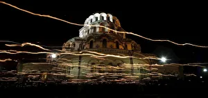 Worshippers walk with candles around the golden-domed Alexander Nevski cathedral during Worshippers walk with candles around the golden-domed Alexander Nevski cathedral during