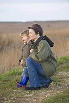mother and son on bird reserve at Cley Norfolk winter mother and son on bird reserve at Cley Norfolk winter
