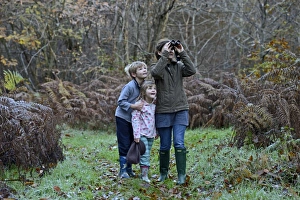 Mother, son and daughter on woodland walk in autumn Norfolk Mother, son and daughter on woodland walk in autumn Norfolk
