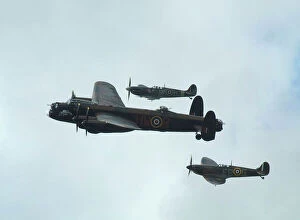 Images Dated 17th September 2011: Lancaster Bomber with 2 Spitfire Fighter planes, 2011 Goodwood revival