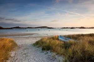 Images Dated 4th May 2012: View of boat on beach and moored in bay at sunrise, Porth Green, Old Grimsby, Tresco