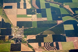 Aerial view of small town surrounded by patchwork quilt of agricultural fields in Willamette Valley Aerial view of small town surrounded by patchwork quilt of agricultural fields in Willamette Valley