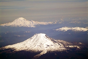 Aerial view of snow capped Mt. Adams and Mt. Rainier in the Washington Cascades Aerial view of snow capped Mt. Adams and Mt. Rainier in the Washington Cascades
