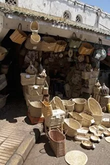 Africa, Morocco, Casablanca. Central Market (aka Olive Market). Basket vendor