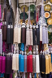 Images Dated 17th April 2015: Africa, Morocco, Marrakech. Curtain tie-backs for sale at a market stall in the medina