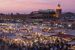 Africa, Morocco. Sunset over the famous Djemaa El-Fna square in Marrakech Africa, Morocco. Sunset over the famous Djemaa El-Fna square in Marrakech