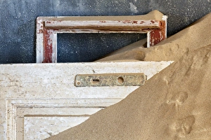 Africa, Namibia, Kolmanskop. Detail of door and window frame Africa, Namibia, Kolmanskop. Detail of door and window frame