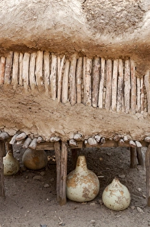 Africa, Namibia, Opuwo. Gourds under food storage hut Africa, Namibia, Opuwo. Gourds under food storage hut