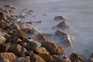 Africa, South Africa, Cape Town. Rocks and waves on Llandudno Beach at sunset. South Africa Africa, South Africa, Cape Town. Rocks and waves on Llandudno Beach at sunset. South Africa