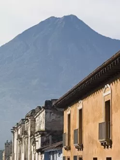 Images Dated 29th December 2006: Antigua, Guatemala Building facades and nearby vocano