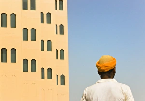 Arabic man with traditional house, old town, Dubai, UAE Arabic man with traditional house, old town, Dubai, UAE