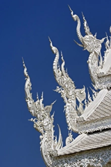 Architectural details (Elephant & Dragon) on the new all white temple of Wat Rong Architectural details (Elephant & Dragon) on the new all white temple of Wat Rong