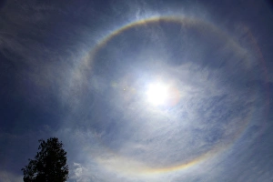 Asia, Bhutan. When a circle appears around the sun, Buddhists in Bhutan believe that Asia, Bhutan. When a circle appears around the sun, Buddhists in Bhutan believe that