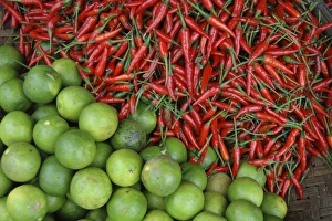 Asia, Vietnam. Limes and chili peppers for sale at the Dong Ba Market, Hue, Thua Asia, Vietnam. Limes and chili peppers for sale at the Dong Ba Market, Hue, Thua