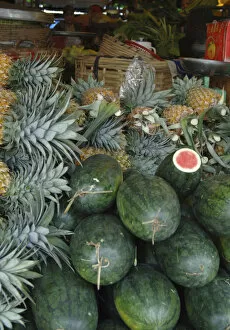 Images Dated 15th January 2006: Asia, Vietnam. Watermelons and pineapples for sale at a local market, Can Tho