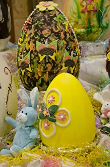 Images Dated 19th April 2014: Australia. Easter display of holiday chocolate eggs and blue stuffed Easter Bunny
