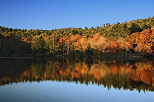 Autumn foliage mirrored on Bass Lake, near Blowing Rock, North Carolina Autumn foliage mirrored on Bass Lake, near Blowing Rock, North Carolina