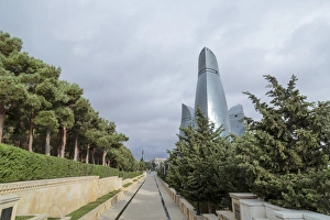 Azerbaijan, Baku. A walkway in Dagustu park, with the Flame Towers in the background Azerbaijan, Baku. A walkway in Dagustu park, with the Flame Towers in the background