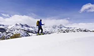 Backcountry skier under Banner and Ritter Peaks in the Ansel Adams Wilderness, Sierra Backcountry skier under Banner and Ritter Peaks in the Ansel Adams Wilderness, Sierra