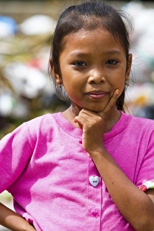 Bali, Indonesia. It is common to see families living, and children playing, in dangerously Bali, Indonesia. It is common to see families living, and children playing, in dangerously