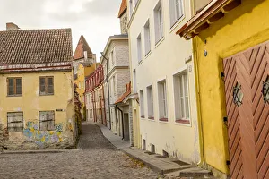 Baltic States, Estonia, Tallinn. Cobblestone street in the old city Baltic States, Estonia, Tallinn. Cobblestone street in the old city