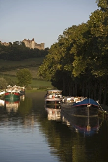Barges tied to bank of Burgundy Canal, Chateau Neuf en Auxois, Cote d'Or, Burgundy Barges tied to bank of Burgundy Canal, Chateau Neuf en Auxois, Cote d'Or, Burgundy