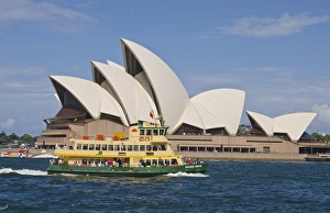 Beautiful closeup of famous Sydney Opera House in Sydney Harbour with ferry passing Beautiful closeup of famous Sydney Opera House in Sydney Harbour with ferry passing