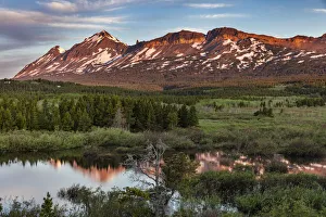 Beaver ponds at sunrise at Marias Pass in Glacier National Park, Montana, USA Beaver ponds at sunrise at Marias Pass in Glacier National Park, Montana, USA