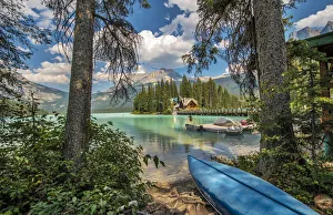 Blue canoe on shore of Emerald lake in Yoho National Park, Canada Blue canoe on shore of Emerald lake in Yoho National Park, Canada