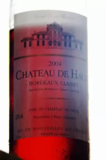 A bottle of Chateau de Haux rose clairet wine backlit Chateau de Haux Premieres