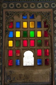 Brightly colored glass window, City Palace, Udaipur, Rajasthan, India Brightly colored glass window, City Palace, Udaipur, Rajasthan, India