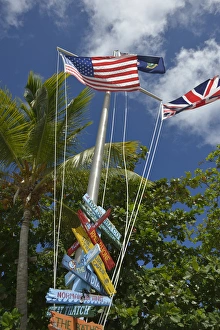 British Virgin Islands, Marina Cay. Colorful flags and direction signs British Virgin Islands, Marina Cay. Colorful flags and direction signs
