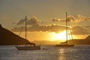 British Virgin Islands, Tortola. Caribbean sunset with sailboats at Sopers Hole British Virgin Islands, Tortola. Caribbean sunset with sailboats at Sopers Hole