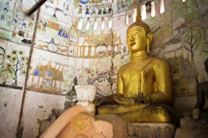 Rundown Gallery: A buddha sits in an ancient buddhist temples in Xe Champhone, Laos