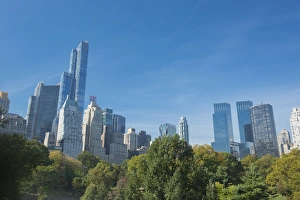 Buildings along Central Park South will Wollman Rink in Central Park, New York City, NY Buildings along Central Park South will Wollman Rink in Central Park, New York City, NY