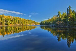 Canada, Ontario. Forest reflections on Blindfold Lake in autumn