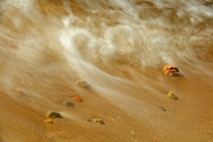 Canada, Ontario. Waves crashing against pebbles on shore of Lake Nipissing. Credit as Canada, Ontario. Waves crashing against pebbles on shore of Lake Nipissing. Credit as