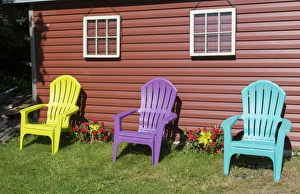 Canada Peggys Cove Nova Scotia barn with colorful Adirondack chairs with flowers Canada Peggys Cove Nova Scotia barn with colorful Adirondack chairs with flowers