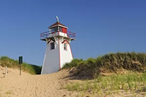 Canada, Prince Edward Island. Lighthouse in sand dune at Covehead Harbour. Credit as